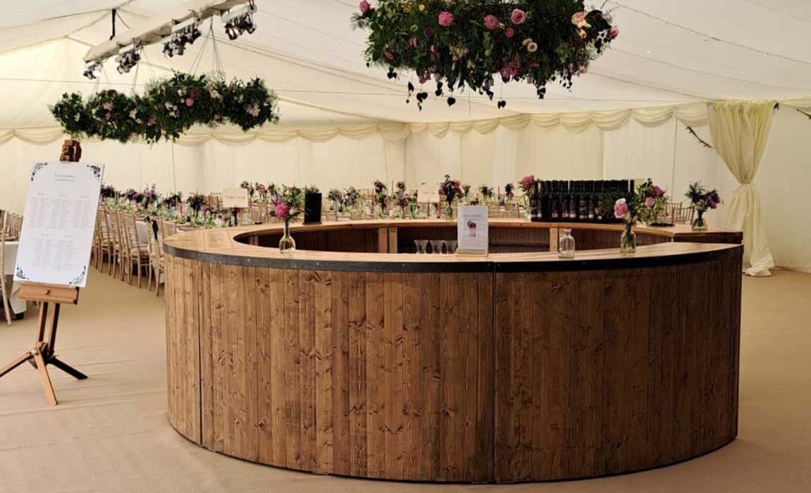Full round rustic bar on hire at wedding