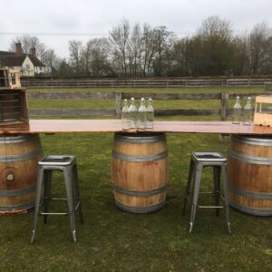 barrel bar and metal stools outside event