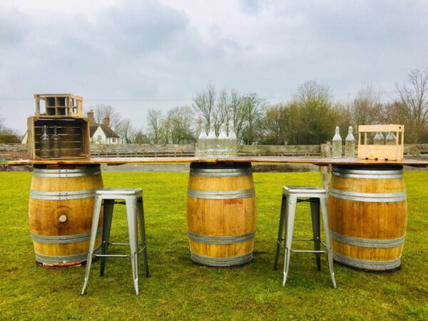 barrel bar and metal stools outside event