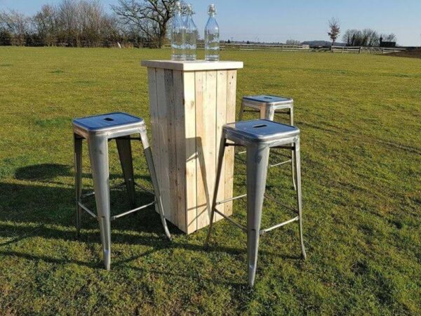 large rustic poseur tables and bar stools